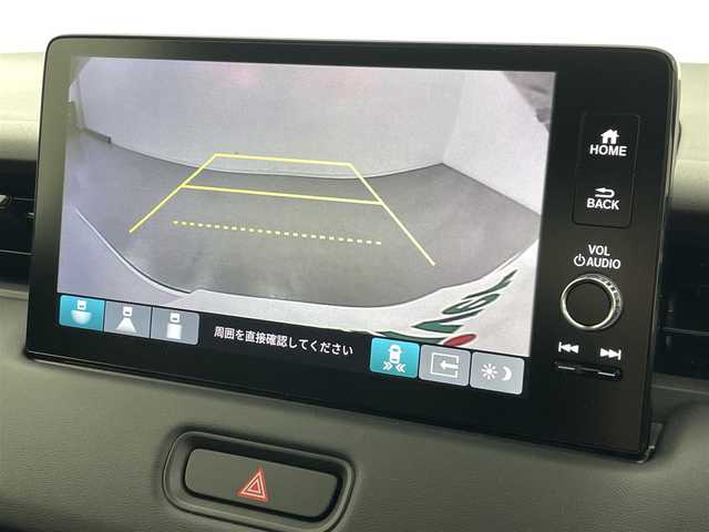 ホンダ ヴェゼル ハイブリッド e:HEV Z 熊本県 2025(令7)年 0.1千km プラチナホワイトパール 登録済未使用車/純正ナビ（ＡｐｐｌＣａｒＰｌａｙ・ＡｎｄｒｏｉｄＡｕｔｏ・フルセグ・ＢＴ・ＵＳＢ）　/バックカメラ　/ビルトインＥＴＣ　/ホンダセンシング/・衝突軽減ブレーキ/・誤発進抑制機能/・後方誤発進抑制機能/・近距離衝突軽減ブレーキ/・歩行者事故低減ステアリング/・路外逸脱制御機能/・アダブティブクルーズコントロール/・渋滞運転支援機能/・先行車発進お知らせ/・標識認識システム/・ブラインドスポットモニター/・車線維持支援システム/・オートハイビーム/横滑り防止/ダウンヒルアシスト/置くだけ充電/前席シートヒーター/ステアリングヒーター/パワーバックドア/パドルシフト/ブレーキホールド/ハーフレザーシート/純正１８インチAW/フロントシーケンシャルウインカー/オートライト/LEDヘッドライト/フォグライト/スマートキー/プッシュスタート/スペアキー1本/保証書/取扱説明書