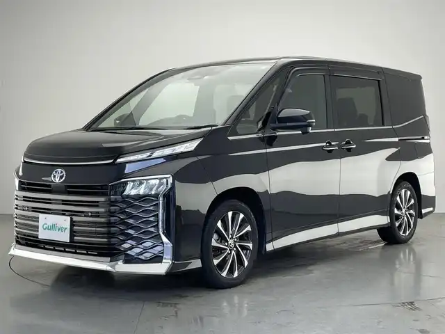 トヨタ ヴォクシー ハイブリッド S－Z 愛知県 2022(令4)年 2.6万km グリッターブラックガラスフレーク 純１０．５型ＤＡナビ　フルセグＴＶ　ＤＶＤ再生　純１４型有機ＥＬ後席モニター　アドバンストドライブ　快適利便Ｈｉｇｈ　パワーバックドア　ＢＳＭ　衝突軽減　ＥＴＣ２．０　ＨＤＭＩ　バックカメラ　禁煙車　黒ハーフレザー　追従クルコン　WAC　オットマン　両側電動スライドドア　オートハイビーム　前後コーナーセンサー