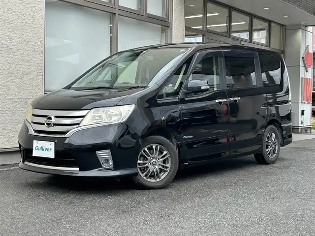 日産 セレナ ハイウェイスター Sハイブリッド 大阪府 2012(平24)年 11.8万km 黒 社外ナビ/（フルセグ／ＢＴ／ＣＤ／ＤＶＤ）/バックカメラ/横滑り機能/社外後席用モニター/純正フロアマット/両側パワースライドドア/３列シート/社外１５インチＡＷ/取扱説明書