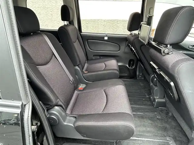 日産 セレナ ハイウェイスター Sハイブリッド 大阪府 2012(平24)年 11.8万km 黒 社外ナビ/（フルセグ／ＢＴ／ＣＤ／ＤＶＤ）/バックカメラ/横滑り機能/社外後席用モニター/純正フロアマット/両側パワースライドドア/３列シート/社外１５インチＡＷ/取扱説明書