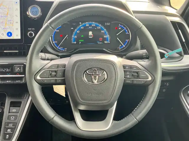 トヨタ ヴォクシー ハイブリッド S－Z 静岡県 2023(令5)年 5.9万km グリッターブラックガラスフレーク 純正10.5インチナビ(CD/DVD/BT/フルセグ)/14インチ後席モニター(V14T-R72R)/純正ETC2.0/ドライブレコーダー前後+車内/エンジンスタートボタン/パワーステアリング/パワーウィンドウ/アイドリングストップ/100V充電/スマートキー/Wオートエアコン/レーダークルーズコントロール/USB入力端子/バックカメラ/三列シート/純正フロアマット/ハーフレザーシート/D席N席シートヒーター/両側パワースライドドア/純正17インチアルミホイール/ABS/横滑り防止装置/コーナーセンサー前後/レーンキープアシスト/オートライト/オートマチックハイビーム/LEDヘッドライト/W+サイドエアバック/衝突軽減システム/HDMI接続