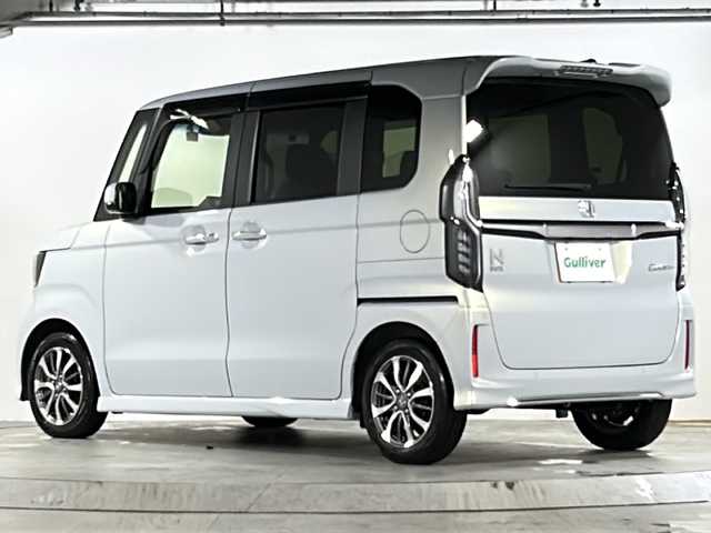 ホンダ Ｎ ＢＯＸ カスタム L 広島県 2022(令4)年 3.3万km プレミアムサンライトホワイトパール 純正7型ＳＤナビ/CD/DVD/SD/BT/フルセグTV/バックカメラ/Honda SENSING/・衝突軽減ブレーキ/・オートハイビーム/・誤発進抑制機能/・後方誤発進抑制機能/・路外逸脱警報機能/・アダプティブクルーズコントロール/・車線維持支援システム/・歩行者事故低減ステアリング/・先行車発進お知らせ機能/・標識認識機能/片側パワースライドドア/充電用USBジャック/シートヒーター/シートバックテーブル/スマートキー/プッシュスタート/ETC/電動パーキングブレーキ/LEDヘッドライト/オートライト/純正フロアマット/純正ドアバイザー/純正アルミホイール