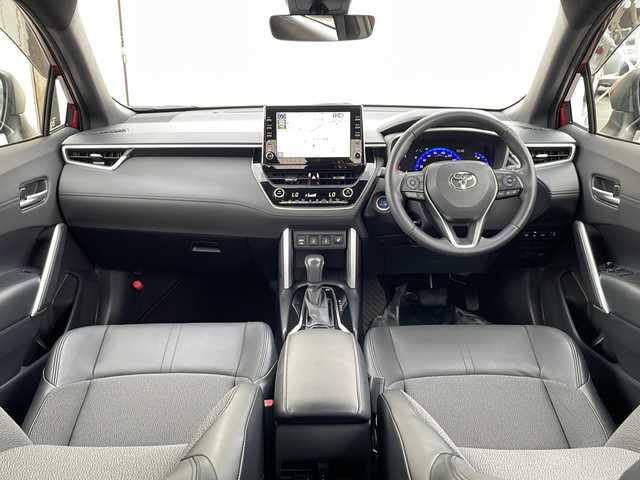 トヨタ カローラ クロス ハイブリッド Z 道北・旭川 2023(令5)年 1.2万km センシュアルレッドマイカ ・4WD/・寒冷地仕様/・禁煙車/・純正ディスプレイオーディオ/　BT/USB/・バックカメラ/・ハンズフリー電動リアゲート/・前席シートヒーター/・ハンドルヒーター/・純正エンジンスターター/・トヨタセーフティセンス/　レーンキープアシスト/　PCS/PKSB/RSA/　レーダークルーズコントロール/・オートライト/・オートマチックハイビーム/・革巻きステアリング/・ステアリングスイッチ/・ミラーヒーター/・パワーシート/・LEDヘッドライト/フォグランプ/・ハーフレザー/・純正フロアマット/・ドアバイザー/・保証書/・スペアキー