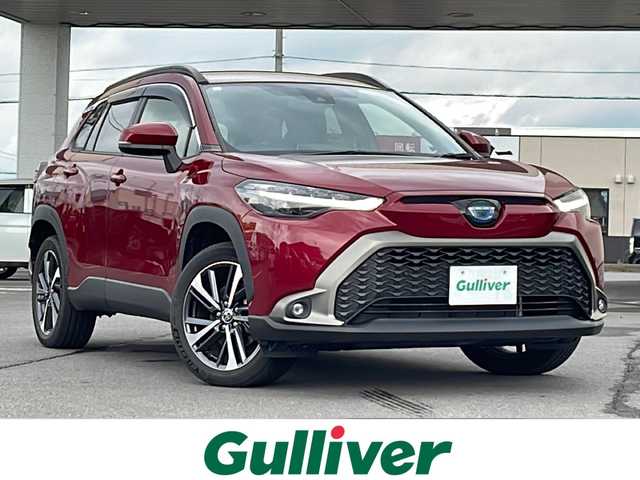トヨタ カローラ クロス ハイブリッド Z 道北・旭川 2023(令5)年 1.2万km センシュアルレッドマイカ ・4WD/・寒冷地仕様/・禁煙車/・純正ディスプレイオーディオ/　BT/USB/・バックカメラ/・ハンズフリー電動リアゲート/・前席シートヒーター/・ハンドルヒーター/・純正エンジンスターター/・トヨタセーフティセンス/　レーンキープアシスト/　PCS/PKSB/RSA/　レーダークルーズコントロール/・オートライト/・オートマチックハイビーム/・革巻きステアリング/・ステアリングスイッチ/・ミラーヒーター/・パワーシート/・LEDヘッドライト/フォグランプ/・ハーフレザー/・純正フロアマット/・ドアバイザー/・保証書/・スペアキー
