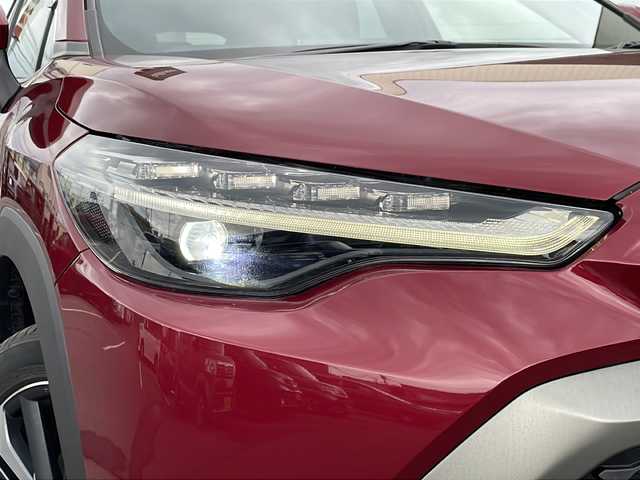トヨタ カローラ クロス ハイブリッド Z 道北・旭川 2023(令5)年 1.2万km センシュアルレッドマイカ ・4WD/・寒冷地仕様/・禁煙車/・純正ディスプレイオーディオ/　BT/USB/・バックカメラ/・ハンズフリー電動リアゲート/・前席シートヒーター/・ハンドルヒーター/・純正エンジンスターター/・トヨタセーフティセンス/　レーンキープアシスト/　PCS/PKSB/RSA/　レーダークルーズコントロール/・オートライト/・オートマチックハイビーム/・革巻きステアリング/・ステアリングスイッチ/・ミラーヒーター/・パワーシート/・LEDヘッドライト/フォグランプ/・ハーフレザー/・純正フロアマット/・ドアバイザー/・保証書/・スペアキー