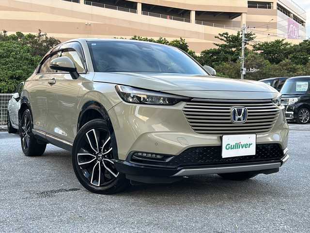 ホンダ ヴェゼル ハイブリッド e:HEV Z 沖縄県 2021(令3)年 7.7万km サンドカーキパール 純正ナビ　ＡＭ／ＦＭ／ＣＤ／ＤＶＤ／ＢＴ/フルセグＴＶ/前後ドラレコ　/ＥＴＣ　/カーテンエアバッグ　/パワーバックドア　/ダウンヒルアシストコントロール　/クルコン　/前席シートヒーター　/ワイヤレス充電器