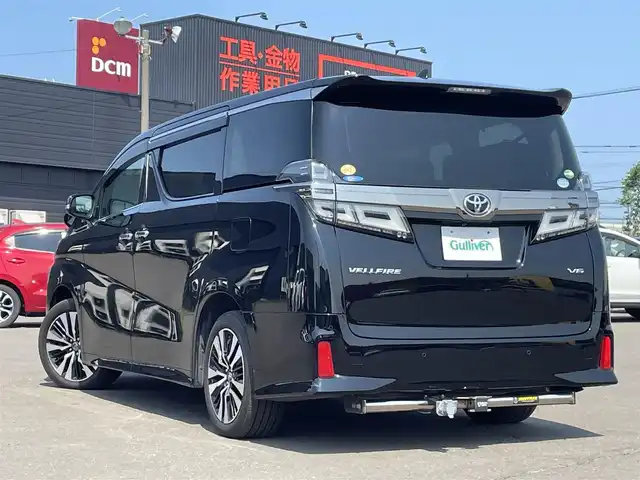 トヨタ ヴェルファイア ZG 道東・釧路十勝 2018(平30)年 2.4万km ブラック ４WD/Toyota Safety Sense/・PCS（プリクラッシュセーフティ）/・緊急時操舵支援/・レーンディパーチャーアラート/・ロードサインアシスト/・ドライバー異常時対応システム/・プロアクティブドライビングアシスト/・オートマチックハイビーム/・アダプティブハイビームシステム/・レーダークルーズコントロール/・先行車発進告知機能/社外メモリーナビ/（CD/DVD/BT)/フルセグTV/バックカメラ/両側パワースライドドア/パワーバックドア/クルーズコントロール/LEDオートライト/LEDフォグランプ/革シート/シートヒーター/パワーシート/エアシート/シートメモリ/純正室内カーテンセット/ステアリングヒーター/ステアリングスイッチ/電動オットマン/オートエアコン/アイドリングストップ/100V充電/電動化駆動ミラー/デジタルインナーミラー/スマートキー/社外ヒッチメンバー/ヘッドレストモニター/社外AW18インチ付きスタットレスタイヤ積込