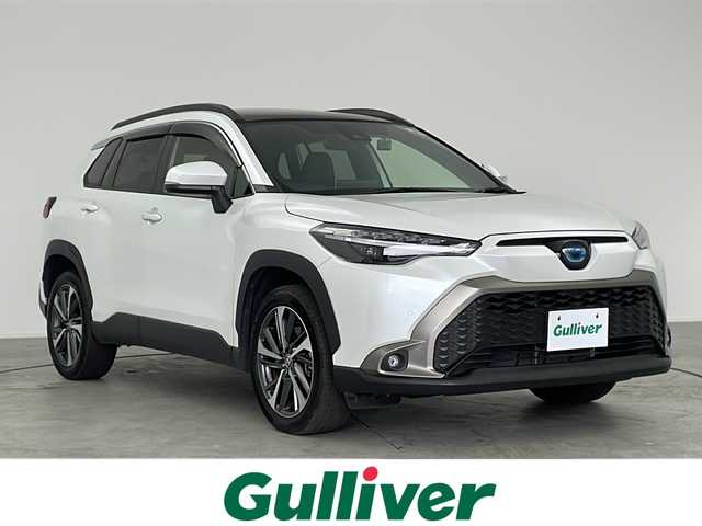 トヨタ カローラ クロス ハイブリッド Z 愛知県 2023(令5)年 2.2万km プラチナホワイトパールマイカ /禁煙車//E-Four//純正9インチディスプレイオーディオ//フルセグTV//ビルトインETC2.0//バックカメラ//社外前後ドライブレコーダー(TZ-DR210)//電動パノラマルーフ//トヨタセーフティセンス//プリクラッシュセーフティ//レーントレーシングアシスト//レーダークルーズ//アダプティブハイビーム//ロードサインアシスト//ブラインドスポットモニター//パーキングサポートブレーキ//先行車発進告知//Bi-Beam LEDヘッドライト//オートライト//シーケンシャルウィンカー//LEDフォグランプ//ルーフレール//ハンズフリーパワーバックドア//本革+ファブリックコンビシート//運転席パワーシート//前席シートヒーター//社外フロアマット//純正ドアバイザー//革巻きステアリング//ステアリングスイッチ//プッシュスタート//電動格納ミラーウィンカー//電子パーキングブレーキ//ブレーキホールド//スペアキー