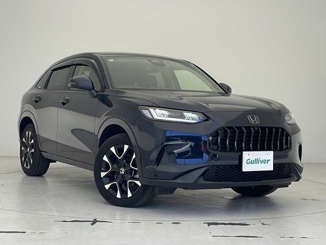 ホンダ ＺＲ－Ｖ ハイブリッド e:HEV Z 沖縄県 2024(令6)年 1.3万km ミッドナイトブルービームM 純正9インチナビ/（BT/フルセグ/USB）/マルチビューカメラ/ビルトインETC2.0/BOSEサウンド/ダウンヒルアシスト/ワイヤレス充電/レザーシート/メモリ付きパワーシート/シートヒーター/ステアリングヒーター/ホンダセンシング/衝突軽減ブレーキ/前後誤発進抑制/ブラインドスポットインフォメーション/追従クルーズコントロール/レーキープアシスト/トラフィックジャムアシスト/標識認識機能/歩行者事故低減ステアリング/パーキングセンサー/後退出庫サポート/オートハイビーム/アダプティブコーナリングライト