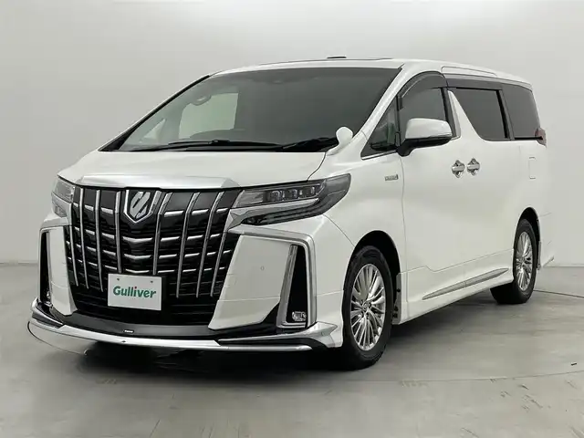 トヨタ アルファードハイブリット SR Cパッケージ 群馬県 2020(令2)年 5.2万km ホワイトパールクリスタルシャイン ツインムーンルーフ/デジタルインナーミラー/ブラインドスポットモニター/リヤクロストラフィックオートブレーキ/モデリスタエアロ/＝＝＝＝＝/純正9インチディスプレイオーディオ/・AM/FM/CD/DVD/Bluetooth/フルセグTV/・Miracast/AppleCarPlay/AndroidAuto/純正フリップダウンモニター/両側パワースライドドア/パワーバックドア/エグゼクティブパワーシート/・ロングスライド/・パワーリクライニング/パワーオットマン/トヨタセーフティセンス/・プリクラッシュセーフティシステム/・レーントレーシングアシスト/・レーダークルーズコントロール(全車速追従機能)/・アダプティブハイビームシステム/前席パワーシート/シートヒーター/シートベンチレーション/プッシュスタート/スマートキー
