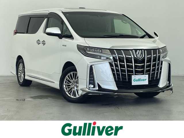 トヨタ アルファードハイブリット SR Cパッケージ 群馬県 2020(令2)年 5.2万km ホワイトパールクリスタルシャイン ツインムーンルーフ/デジタルインナーミラー/ブラインドスポットモニター/リヤクロストラフィックオートブレーキ/モデリスタエアロ/＝＝＝＝＝/純正9インチディスプレイオーディオ/・AM/FM/CD/DVD/Bluetooth/フルセグTV/・Miracast/AppleCarPlay/AndroidAuto/純正フリップダウンモニター/両側パワースライドドア/パワーバックドア/エグゼクティブパワーシート/・ロングスライド/・パワーリクライニング/パワーオットマン/トヨタセーフティセンス/・プリクラッシュセーフティシステム/・レーントレーシングアシスト/・レーダークルーズコントロール(全車速追従機能)/・アダプティブハイビームシステム/前席パワーシート/シートヒーター/シートベンチレーション/プッシュスタート/スマートキー