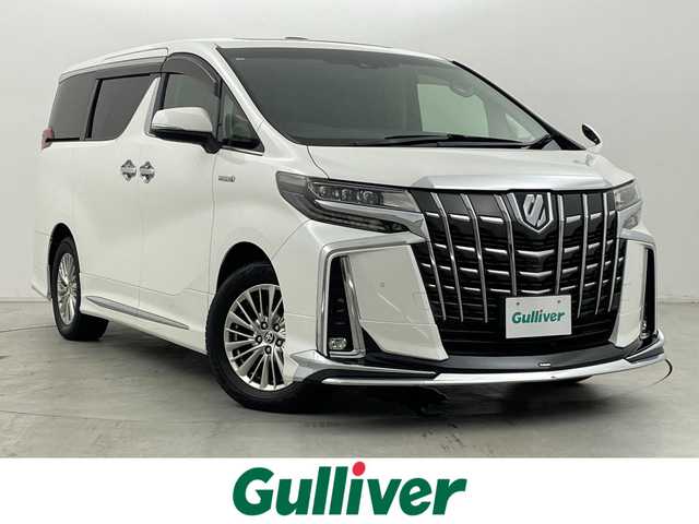 トヨタ アルファードハイブリット SR Cパッケージ 群馬県 2020(令2)年 5.2万km ホワイトパールクリスタルシャイン ツインムーンルーフ/デジタルインナーミラー/ブラインドスポットモニター/リヤクロストラフィックオートブレーキ/モデリスタエアロ/＝＝＝＝＝/純正9インチディスプレイオーディオ/・AM/FM/CD/DVD/Bluetooth/フルセグTV/・Miracast/AppleCarPlay/AndroidAuto/純正フリップダウンモニター/両側パワースライドドア/パワーバックドア/エグゼクティブパワーシート/・ロングスライド/・パワーリクライニング/パワーオットマン/トヨタセーフティセンス/・プリクラッシュセーフティシステム/・レーントレーシングアシスト/・レーダークルーズコントロール(全車速追従機能)/・アダプティブハイビームシステム/前席パワーシート/シートヒーター/シートベンチレーション/プッシュスタート/スマートキー