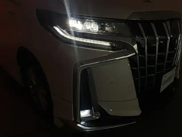 トヨタ アルファードハイブリット SR Cパッケージ 群馬県 2020(令2)年 5.2万km ホワイトパールクリスタルシャイン ツインムーンルーフ/デジタルインナーミラー/ブラインドスポットモニター/リヤクロストラフィックオートブレーキ/モデリスタエアロ/＝＝＝＝＝/純正9インチディスプレイオーディオ/・AM/FM/CD/DVD/Bluetooth/フルセグTV/・Miracast/AppleCarPlay/AndroidAuto/純正フリップダウンモニター/両側パワースライドドア/パワーバックドア/エグゼクティブパワーシート/・ロングスライド/・パワーリクライニング/パワーオットマン/トヨタセーフティセンス/・プリクラッシュセーフティシステム/・レーントレーシングアシスト/・レーダークルーズコントロール(全車速追従機能)/・アダプティブハイビームシステム/前席パワーシート/シートヒーター/シートベンチレーション/プッシュスタート/スマートキー