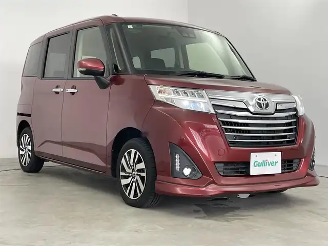 トヨタ ルーミー カスタムG 長崎県 2019(平31)年 4.4万km ファイアークォーツレッドM 純正7インチナビ/フルセグTV/バックカメラ/Bluetooth/トヨタセーフティセンス/衝突被害軽減システム/横滑り防止装置/クルーズコントロール/コーナーセンサー/レーンキープアシスト/オートライト/オートマチックハイビーム/LEDヘッドライト/LEDフォグランプ/両側パワースライドドア/シートヒーター/ドライブレコーダー/ETC/純正AW/純正フロアマット/プッシュスタート/スマートキー