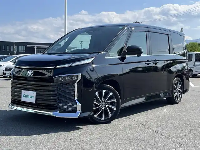トヨタ ヴォクシー ハイブリッド S－Z 奈良県 2022(令4)年 4.7万km アティチュードブラックマイカ 純正10インチディスプレイオーディオ/（フルセグ/BT)/純正14インチフリップダウンモニター（V14T-R72R）/レーダークルーズコントロール/バックカメラ/前後コーナーセンサー/プリクラッシュセーフティ/レーンキープアシスト/両側パワースライドドア/ハーフレザーシート/前席シートヒーター/後席サンシェード/ETC2.0/前方ドライブレコーダー/純正17インチAW/スペアキーX1