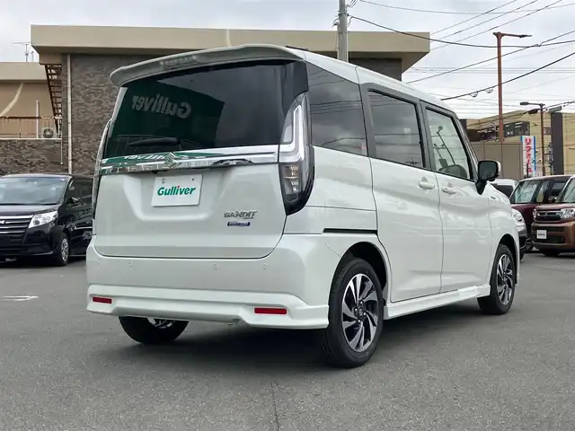 スズキ ソリオ バンディット HV MV 静岡県 2024(令6)年 0.1万km未満 ピュアホワイトP エンジンスタートボタン/スマートキー（スペアキー１本）/パワーステアリング/パワーウィンドウ/アイドリングストップ/オートエアコン/クルーズコントロール/全方位カメラ/USB入力端子/純正メモリナビ（CD.DVD.BT.フルセグ）/D席N席シートヒーター/両側パワースライドドア/ABS/横滑り防止装置/コーナーセンサー/レーンキープアシスト/オートライト/オートマチックハイビーム/LEDライト/W+サイドエアバック/衝突軽減システム