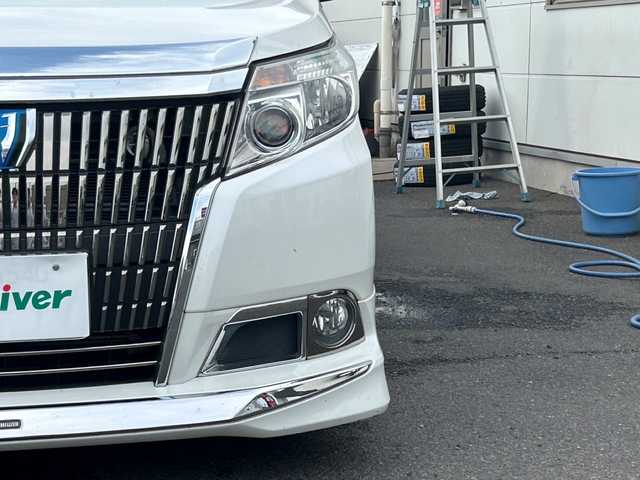 トヨタ エスクァイア ハイブリッド Xi 広島県 2015(平27)年 10.8万km ホワイトパールクリスタルシャイン モデリスタエアロ/モデリスタ17インチアルミホイール/片側パワースライドドア/アルパインビックX11インチナビ/　（DVD/CD/SD/BT/フルセグTV）/アルパインフリップダウンモニター/バックカメラ/ステアリングリモコン/ビルトインETC/前方ドライブレコーダー/前席ヒートシーター/オートリトラミラー/LEDヘッドライト/オートライト/フォグランプ/純正フロアマット/スペアキー/横滑り防止装置/盗難防止装置/保証書/取扱説明書