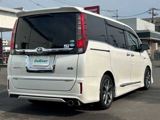 トヨタ エスクァイア ハイブリッド Xi 広島県 2015(平27)年 10.8万km ホワイトパールクリスタルシャイン モデリスタエアロ/モデリスタ17インチアルミホイール/片側パワースライドドア/アルパインビックX11インチナビ/　（DVD/CD/SD/BT/フルセグTV）/アルパインフリップダウンモニター/バックカメラ/ステアリングリモコン/ビルトインETC/前方ドライブレコーダー/前席ヒートシーター/オートリトラミラー/LEDヘッドライト/オートライト/フォグランプ/純正フロアマット/スペアキー/横滑り防止装置/盗難防止装置/保証書/取扱説明書