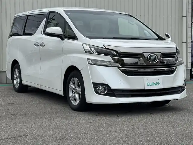 トヨタ ヴェルファイア X 富山県 2016(平28)年 6.9万km ホワイトパールクリスタルシャイン 社外ナビ(AVIC-RZ77)/AM/FM/CD/DVD/Bluetooth/フルセグTV/カロッツェリアフリップダウンモニター/バックカメラ/プリクラッシュセーフティ/両側パワースライドドア/LEDヘッドライト/レーダークルーズコントロール/コーナーセンサー/ETC/プッシュスタート/スペアキー1本/横滑り防止装置/ブレーキホールド/純正16インチアルミホイール