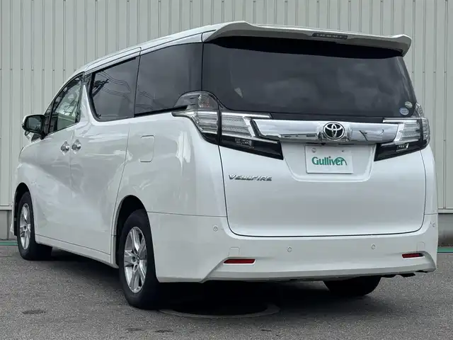トヨタ ヴェルファイア X 富山県 2016(平28)年 6.9万km ホワイトパールクリスタルシャイン 社外ナビ(AVIC-RZ77)/AM/FM/CD/DVD/Bluetooth/フルセグTV/カロッツェリアフリップダウンモニター/バックカメラ/プリクラッシュセーフティ/両側パワースライドドア/LEDヘッドライト/レーダークルーズコントロール/コーナーセンサー/ETC/プッシュスタート/スペアキー1本/横滑り防止装置/ブレーキホールド/純正16インチアルミホイール