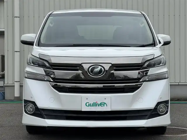 トヨタ ヴェルファイア X 富山県 2016(平28)年 6.9万km ホワイトパールクリスタルシャイン 社外ナビ(AVIC-RZ77)/AM/FM/CD/DVD/Bluetooth/フルセグTV/カロッツェリアフリップダウンモニター/バックカメラ/プリクラッシュセーフティ/両側パワースライドドア/LEDヘッドライト/レーダークルーズコントロール/コーナーセンサー/ETC/プッシュスタート/スペアキー1本/横滑り防止装置/ブレーキホールド/純正16インチアルミホイール