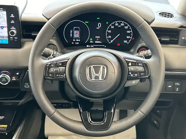 ホンダ ヴェゼル ハイブリッド e:HEV Z 埼玉県 2025(令7)年 0.1千km プラチナホワイトパール ホンダセンシング/純正9インチナビ/ BT/USB/フルセグ/バックカメラ/ハーフレザーシート/シートヒーター/パワーバックドア/純正18インチアルミホイール/コーナーセンサー/ステアリングヒーター/ワイヤレス充電/オートブレーキホールド/レーダークルーズコントロール/レーンキープアシスト/ETC2.0/スマートキー×2/禁煙車