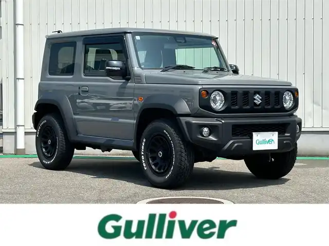 スズキ ジムニー シエラ JC 富山県 2023(令5)年 1万km ミディアムグレー ワンオーナー/4WD/クルーズコントロール/レーンキープアシスト/横滑り防止装置/衝突軽減システム/ダウンヒルアシストコントロール/社外SDナビ/フルセグTV/Bluetooth/DVD再生/バックカメラ/ビルトインETC/社外アルミホイール/運転席助手席シートヒーター