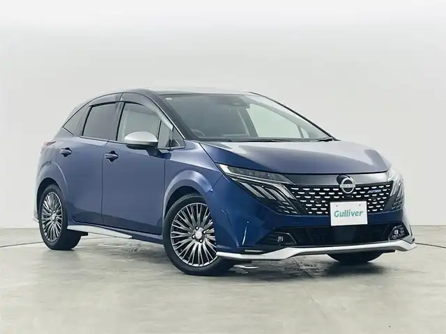日産 オーラ オーテック 福島県 2025(令7)年 0.3万km オーロラフレアブルーパール /スーパーブラック 2トーン インテリジェントエマージェンシーブレーキ/・緊急停止支援システム/・前方衝突予測警報/・アダプティブLEDヘッドライト/・ふらつき防止装置/・標識検知機能/・車線逸脱警報装置/・後側方衝突防止支援システム/・後側方車両検知警報/・アラウンドビューモニター/・踏み間違い衝突防止アシスト/・後退時車両検知警報/純正9インチナビ/（TV/BT/AM・FM/HDMI）/・バックカメラ/ビルトインETC/デジタルインナーミラー/純正17インチアルミ/電子パーキング/・オートブレーキホールド/ブラインドスポットモニター/ヘッドアップディスプレイ/プッシュスタート/・スマートキー/純正フロアマット/D席パワーシート/・レザーシート/プッシュスタート/LEDライト/・オートライト/電動格納ミラー/ドアバイザー