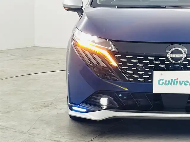 日産 オーラ オーテック 福島県 2025(令7)年 0.3万km オーロラフレアブルーパール /スーパーブラック 2トーン インテリジェントエマージェンシーブレーキ/・緊急停止支援システム/・前方衝突予測警報/・アダプティブLEDヘッドライト/・ふらつき防止装置/・標識検知機能/・車線逸脱警報装置/・後側方衝突防止支援システム/・後側方車両検知警報/・アラウンドビューモニター/・踏み間違い衝突防止アシスト/・後退時車両検知警報/純正9インチナビ/（TV/BT/AM・FM/HDMI）/・バックカメラ/ビルトインETC/デジタルインナーミラー/純正17インチアルミ/電子パーキング/・オートブレーキホールド/ブラインドスポットモニター/ヘッドアップディスプレイ/プッシュスタート/・スマートキー/純正フロアマット/D席パワーシート/・レザーシート/プッシュスタート/LEDライト/・オートライト/電動格納ミラー/ドアバイザー