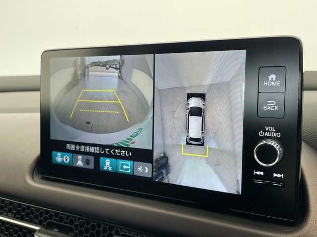 ホンダ ＺＲ－Ｖ ハイブリッド e:HEV Z 愛知県 2024(令6)年 1.5万km プラチナホワイトパール ホンダセンシング/BOSEプレミアムサウンド/純正9インチディスプレイオーディオナビ（あり）/全方位カメラ/レーダークルーズコントロール/シートヒーター/バックカメラ/電動リアゲート/パワーシート/コーナーセンサー/純正アルミホイール/ETC2.0/ブラインドスポットモニター/LEDヘッドライト/ステアリングヒーター/パドルシフト/ダウンヒルアシストコントロール/オートマチックハイビーム/ドライブレコーダー/ワイヤレス充電器/衝突被害軽減ブレーキ/フルセグTV/Bluetooth/ステアリングスイッチ/スマートキー/プッシュスタート