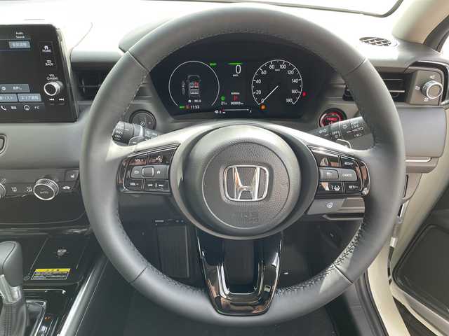 ホンダ ヴェゼル ハイブリッド e:HEV Z 愛知県 2025(令7)年 0.1千km プラチナホワイトパール ホンダセンシング/純正9型ディスプレイオーディオナビ/レーダークルーズコントロール/シートヒーター/バックカメラ/電動リアゲート/コーナーセンサー/純正アルミホイール/ETC2.0/ブラインドスポットモニター/LEDヘッドライト/ステアリングヒーター/ワイヤレス充電機/オートマチックハイビーム/ダウンヒルアシストコントロール/衝突軽減システム/フルセグ/Bluetooth/ステアリングスイッチ/スマートキー/プッシュスタート