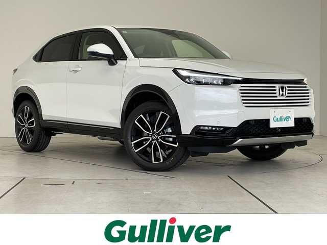 ホンダ ヴェゼル ハイブリッド e:HEV Z 愛知県 2025(令7)年 0.1千km プラチナホワイトパール ホンダセンシング/純正9型ディスプレイオーディオナビ/レーダークルーズコントロール/シートヒーター/バックカメラ/電動リアゲート/コーナーセンサー/純正アルミホイール/ETC2.0/ブラインドスポットモニター/LEDヘッドライト/ステアリングヒーター/ワイヤレス充電機/オートマチックハイビーム/ダウンヒルアシストコントロール/衝突軽減システム/フルセグ/Bluetooth/ステアリングスイッチ/スマートキー/プッシュスタート