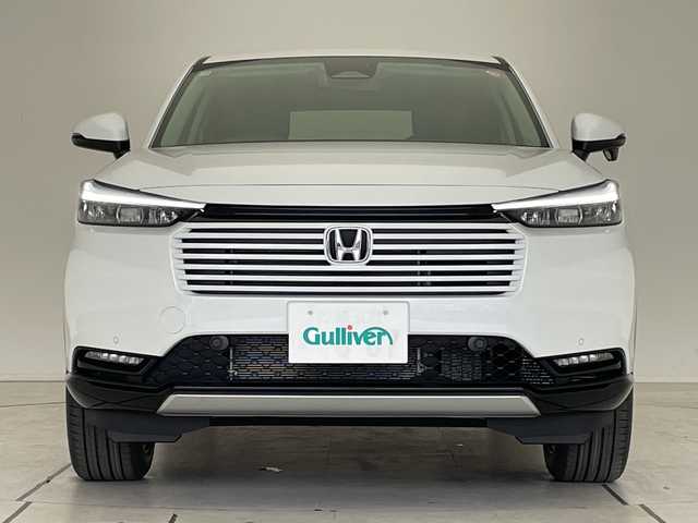 ホンダ ヴェゼル ハイブリッド e:HEV Z 愛知県 2025(令7)年 0.1千km プラチナホワイトパール ホンダセンシング/純正9型ディスプレイオーディオナビ/レーダークルーズコントロール/シートヒーター/バックカメラ/電動リアゲート/コーナーセンサー/純正アルミホイール/ETC2.0/ブラインドスポットモニター/LEDヘッドライト/ステアリングヒーター/ワイヤレス充電機/オートマチックハイビーム/ダウンヒルアシストコントロール/衝突軽減システム/フルセグ/Bluetooth/ステアリングスイッチ/スマートキー/プッシュスタート