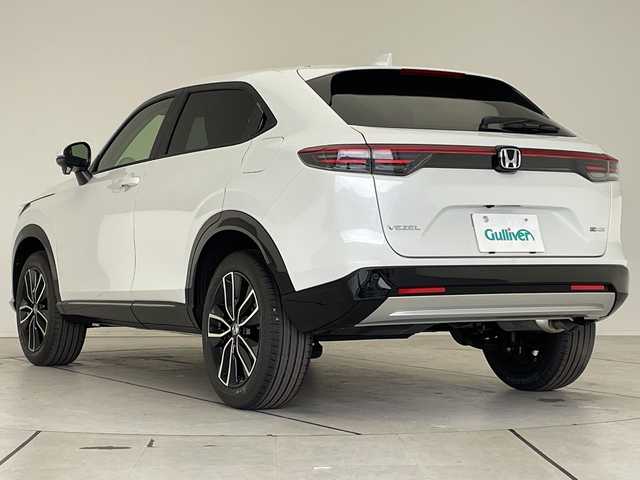 ホンダ ヴェゼル ハイブリッド e:HEV Z 愛知県 2025(令7)年 0.1千km プラチナホワイトパール ホンダセンシング/純正9型ディスプレイオーディオナビ/レーダークルーズコントロール/シートヒーター/バックカメラ/電動リアゲート/コーナーセンサー/純正アルミホイール/ETC2.0/ブラインドスポットモニター/LEDヘッドライト/ステアリングヒーター/ワイヤレス充電機/オートマチックハイビーム/ダウンヒルアシストコントロール/衝突軽減システム/フルセグ/Bluetooth/ステアリングスイッチ/スマートキー/プッシュスタート