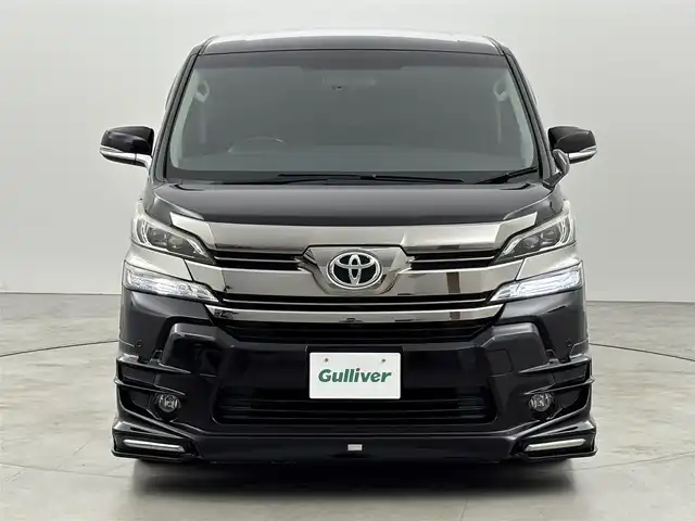 トヨタ ヴェルファイア Z Aエディション 福岡県 2017(平29)年 7.7万km バーニングブラッククリスタルシャインガラスフレーク ＴＲＤエアロ　/後席モニター　/純正９型ナビ（フルセグＴＶ）　/両側電動スライドドア　/クルーズコントロール　/衝突軽減　/コーナーセンサー　/レーンキープ　/オートライト　/横滑り防止　/オットマン　/ビルトインＥＴＣ