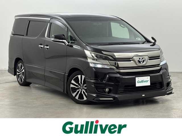 トヨタ ヴェルファイア Z Aエディション 福岡県 2017(平29)年 7.7万km バーニングブラッククリスタルシャインガラスフレーク ＴＲＤエアロ　/後席モニター　/純正９型ナビ（フルセグＴＶ）　/両側電動スライドドア　/クルーズコントロール　/衝突軽減　/コーナーセンサー　/レーンキープ　/オートライト　/横滑り防止　/オットマン　/ビルトインＥＴＣ