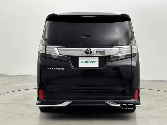 トヨタ ヴェルファイア Z Aエディション 福岡県 2017(平29)年 7.7万km バーニングブラッククリスタルシャインガラスフレーク ＴＲＤエアロ　/後席モニター　/純正９型ナビ（フルセグＴＶ）　/両側電動スライドドア　/クルーズコントロール　/衝突軽減　/コーナーセンサー　/レーンキープ　/オートライト　/横滑り防止　/オットマン　/ビルトインＥＴＣ