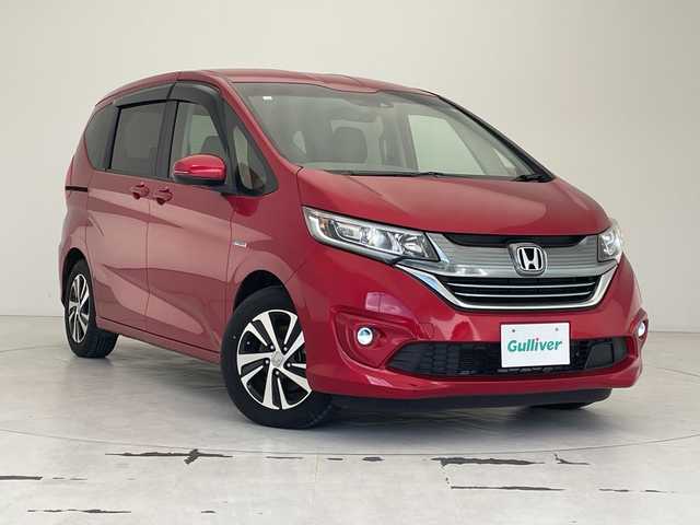 ホンダ フリード ハイブリット G ホンダセンシング 沖縄県 2018(平30)年 1.9万km 赤 純正９インチナビ　（VXM-197VFNi）/（フルセグTV　BLUETOOTH　SD　CD　DVD)　/バックカメラ　/ドライブレコーダー　/ＥＴＣ　/両側パワースライドドア　/ホンダセンシング/クルーズコントロール　/ＬＥＤヘッドライト　/オートライト　/スマートキー/プッシュスタート/オートエアコン/純正15インチアルミホイール/純正フロアマット