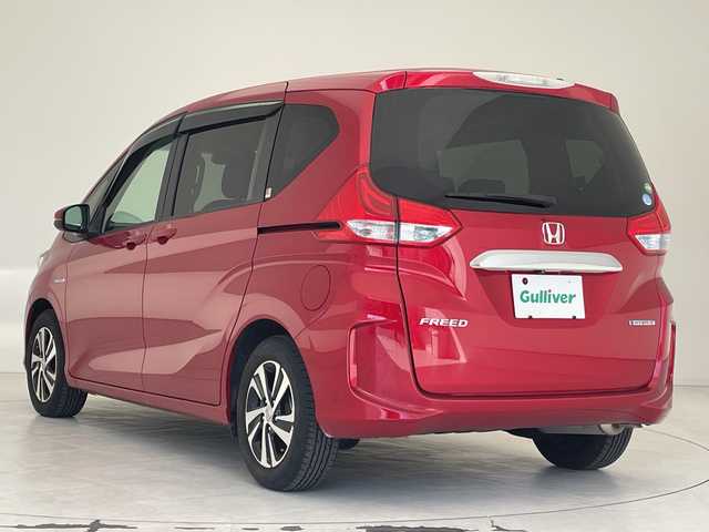 ホンダ フリード ハイブリット G ホンダセンシング 沖縄県 2018(平30)年 1.9万km 赤 純正９インチナビ　（VXM-197VFNi）/（フルセグTV　BLUETOOTH　SD　CD　DVD)　/バックカメラ　/ドライブレコーダー　/ＥＴＣ　/両側パワースライドドア　/ホンダセンシング/クルーズコントロール　/ＬＥＤヘッドライト　/オートライト　/スマートキー/プッシュスタート/オートエアコン/純正15インチアルミホイール/純正フロアマット