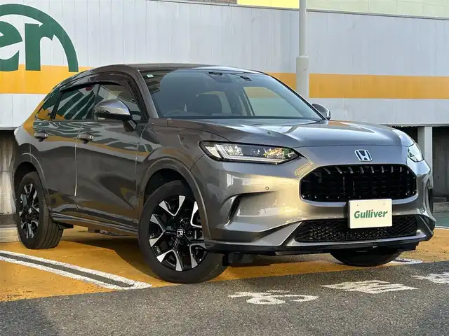 ホンダ ＺＲ－Ｖ ハイブリッド e:HEV Z 静岡県 2024(令6)年 0.4万km スーパープラチナグレーメタリック ワンオーナー/純正ナビ/フルセグTV/BT/USB/全方位カメラ/BOSEサウンドシステム/黒革シート/前席パワーシート/前席シートヒーター /運転席シートメモリー/パワーバックドア/前後ドライブレコーダー/衝突軽減ブレーキ/レーンキープアシスト/ブラインドスポットモニター/レーダークルーズコントロール/クリアランスソナー/置くだけ充電/ステアリングヒーター/ビルトインETC2.0/純正18インチAW/スマートキー×2/保証書/取扱説明書