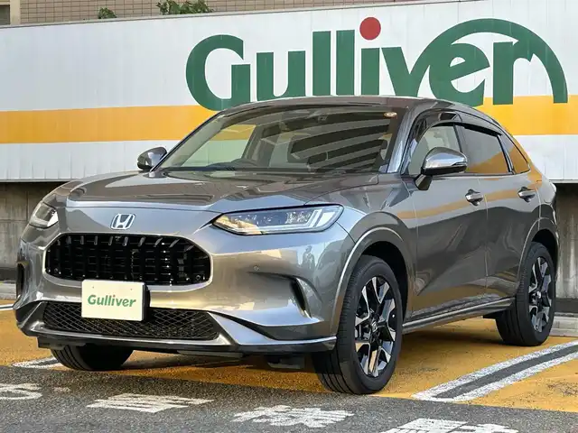 ホンダ ＺＲ－Ｖ ハイブリッド e:HEV Z 静岡県 2024(令6)年 0.4万km スーパープラチナグレーメタリック ワンオーナー/純正ナビ/フルセグTV/BT/USB/全方位カメラ/BOSEサウンドシステム/黒革シート/前席パワーシート/前席シートヒーター /運転席シートメモリー/パワーバックドア/前後ドライブレコーダー/衝突軽減ブレーキ/レーンキープアシスト/ブラインドスポットモニター/レーダークルーズコントロール/クリアランスソナー/置くだけ充電/ステアリングヒーター/ビルトインETC2.0/純正18インチAW/スマートキー×2/保証書/取扱説明書