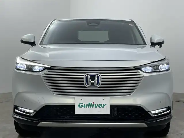 ホンダ ヴェゼル ハイブリッド e:HEV Z 岡山県 2021(令3)年 5.1万km プレミアムサンライトホワイトパール 純正9インチナビ/・バックカメラ/・FM/AM/Bluetooth/フルセグ/USB/ホンダセンシング/・衝突軽減ブレーキ/・車線維持支援システム/・アダプティブクルーズコントロール/・誤発信抑制機能/・オートハイビーム/・コーナーセンサー/ハーフレザーシート/・D/Nシートヒーター/パワーバックドア/ステアリングヒーター/パドルシフト/2.0ETC/LEDヘッドライト/純正18インチアルミ/純正フロアマット/ドアバイザー/ISOFIX