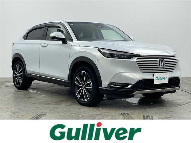 ホンダ ヴェゼル ハイブリッド e:HEV Z 岡山県 2021(令3)年 5.1万km プレミアムサンライトホワイトパール 純正9インチナビ/・バックカメラ/・FM/AM/Bluetooth/フルセグ/USB/ホンダセンシング/・衝突軽減ブレーキ/・車線維持支援システム/・アダプティブクルーズコントロール/・誤発信抑制機能/・オートハイビーム/・コーナーセンサー/ハーフレザーシート/・D/Nシートヒーター/パワーバックドア/ステアリングヒーター/パドルシフト/2.0ETC/LEDヘッドライト/純正18インチアルミ/純正フロアマット/ドアバイザー/ISOFIX