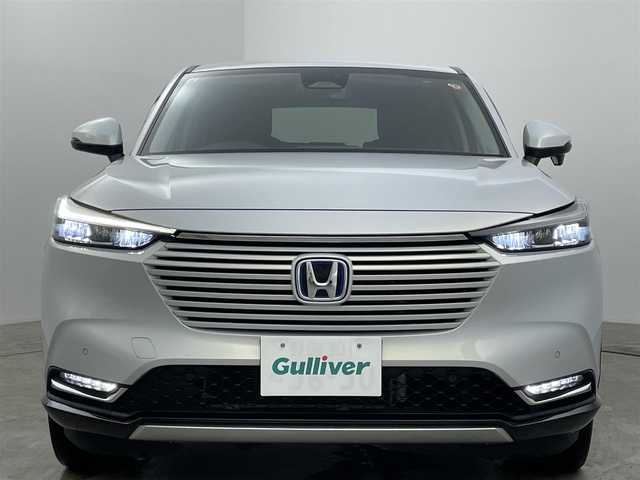 ホンダ ヴェゼル ハイブリッド e:HEV Z 岡山県 2021(令3)年 5.1万km プレミアムサンライトホワイトパール 純正9インチナビ/・バックカメラ/・FM/AM/Bluetooth/フルセグ/USB/ホンダセンシング/・衝突軽減ブレーキ/・車線維持支援システム/・アダプティブクルーズコントロール/・誤発信抑制機能/・オートハイビーム/・コーナーセンサー/ハーフレザーシート/・D/Nシートヒーター/パワーバックドア/ステアリングヒーター/パドルシフト/2.0ETC/LEDヘッドライト/純正18インチアルミ/純正フロアマット/ドアバイザー/ISOFIX