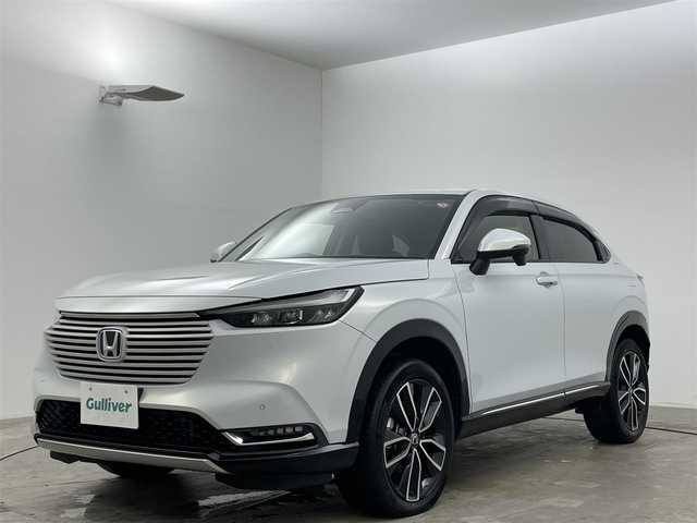 ホンダ ヴェゼル ハイブリッド e:HEV Z 岡山県 2021(令3)年 5.1万km プレミアムサンライトホワイトパール 純正9インチナビ/・バックカメラ/・FM/AM/Bluetooth/フルセグ/USB/ホンダセンシング/・衝突軽減ブレーキ/・車線維持支援システム/・アダプティブクルーズコントロール/・誤発信抑制機能/・オートハイビーム/・コーナーセンサー/ハーフレザーシート/・D/Nシートヒーター/パワーバックドア/ステアリングヒーター/パドルシフト/2.0ETC/LEDヘッドライト/純正18インチアルミ/純正フロアマット/ドアバイザー/ISOFIX