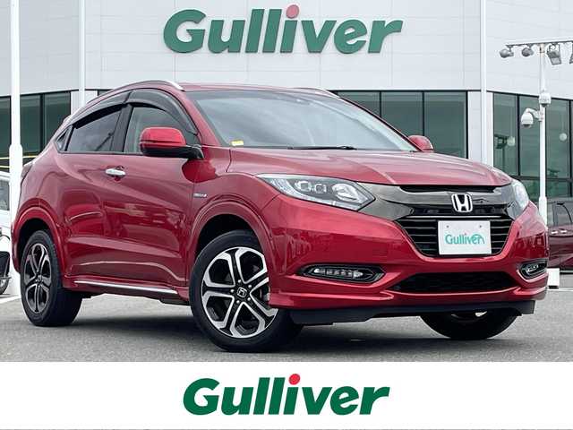 ホンダ ヴェゼル ハイブリッド Z ホンダセンシング 佐賀県 2018(平30)年 5.1万km プレミアムクリスタルレッドM ワンオーナー/純正メモリナビ/フルセグTV/・CD/DVD/SD/USB/Bluetooth/バックカメラ/前方ドライブレコーダー/ビルトインETC/電子パーキングブレーキ/BRAKE　HOLD機能/パドルシフト/ハーフレザーシート/D＋N席シートヒーター/革巻きステアリング/ステアリングリモコン/純正17インチアルミホイール/純正LEDヘッドライト/純正LEDフォグライト/純正フロアマット/純正ドアバイザ―/新車保証書/取扱説明書/スペアキー１本/ホンダセンシング/・アダプティブクルーズコントロール/・路外逸脱抑制システム/・衝突軽減ブレーキ/・先行車発進お知らせ機能/・リアクティブフォースペダル/・標識認識機能