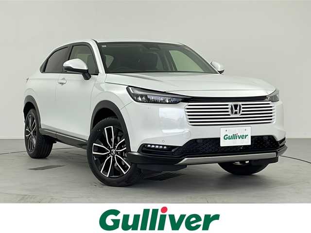 ホンダ ヴェゼル ハイブリッド e:HEV Z 愛知県 2025(令7)年 0.1千km プラチナホワイトパール /R7年10月登録済未使用車//純正HondaCONNECTナビ//フルセグTV/AMFM/Bluetooth/USB//AppleCarPlay/AndroidAuto//ビルトインETC2.0//バックカメラ//HondaSENSING//アダプティブクルーズコントロール//パーキングセンサーシステム//ブラインドスポットモニター//アダプティブドライビングビーム//後退出庫サポート//フルLEDヘッドランプ//オートライト//LEDアクティブコーナリングライト//LEDフォグランプ//フルLEDリアコンビランプ//ハンズフリーパワーテールゲート//プライムスムースコンビシート//前席シートヒーター//革巻きステアリング//ステアリングスイッチ//ステアリングヒーター//パドルシフト式減速セレクター//純正18インチアルミホイール//電子パーキングブレーキ//ブレーキホールド//ヒルディセントコントロール//プッシュスタート//電動格納ミラー//アイドリングストップ//取扱説明書