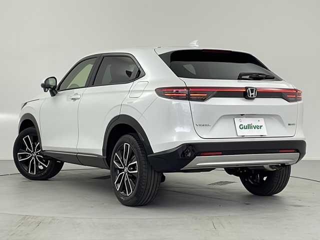 ホンダ ヴェゼル ハイブリッド e:HEV Z 愛知県 2025(令7)年 0.1千km プラチナホワイトパール /R7年10月登録済未使用車//純正HondaCONNECTナビ//フルセグTV/AMFM/Bluetooth/USB//AppleCarPlay/AndroidAuto//ビルトインETC2.0//バックカメラ//HondaSENSING//アダプティブクルーズコントロール//パーキングセンサーシステム//ブラインドスポットモニター//アダプティブドライビングビーム//後退出庫サポート//フルLEDヘッドランプ//オートライト//LEDアクティブコーナリングライト//LEDフォグランプ//フルLEDリアコンビランプ//ハンズフリーパワーテールゲート//プライムスムースコンビシート//前席シートヒーター//革巻きステアリング//ステアリングスイッチ//ステアリングヒーター//パドルシフト式減速セレクター//純正18インチアルミホイール//電子パーキングブレーキ//ブレーキホールド//ヒルディセントコントロール//プッシュスタート//電動格納ミラー//アイドリングストップ//取扱説明書