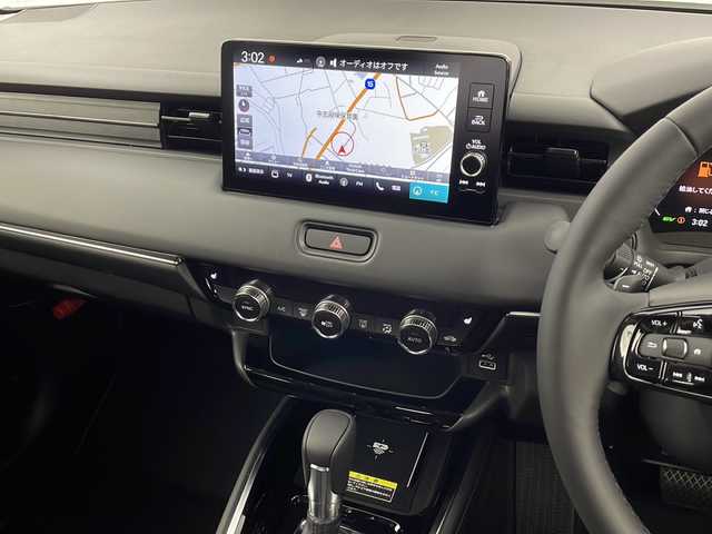 ホンダ ヴェゼル ハイブリッド e:HEV Z 愛知県 2025(令7)年 0.1千km プラチナホワイトパール /R7年10月登録済未使用車//純正HondaCONNECTナビ//フルセグTV/AMFM/Bluetooth/USB//AppleCarPlay/AndroidAuto//ビルトインETC2.0//バックカメラ//HondaSENSING//アダプティブクルーズコントロール//パーキングセンサーシステム//ブラインドスポットモニター//アダプティブドライビングビーム//後退出庫サポート//フルLEDヘッドランプ//オートライト//LEDアクティブコーナリングライト//LEDフォグランプ//フルLEDリアコンビランプ//ハンズフリーパワーテールゲート//プライムスムースコンビシート//前席シートヒーター//革巻きステアリング//ステアリングスイッチ//ステアリングヒーター//パドルシフト式減速セレクター//純正18インチアルミホイール//電子パーキングブレーキ//ブレーキホールド//ヒルディセントコントロール//プッシュスタート//電動格納ミラー//アイドリングストップ//取扱説明書