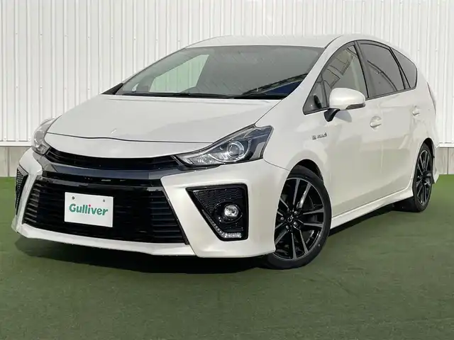 トヨタ プリウス α S ツーリングセレクション G’s 香川県 2016(平28)年 7万km ホワイトパールクリスタルシャイン 登録時走行距離：69939km/ディーラー純正8型SDナビ/　CD DVD BT フルセグTV/バックカメラ/グレード専用セミバケッドハーフレザーシート/ビルトインETC/LEDヘッドライト/オートライト/フォグランプ/革巻きステアリング/ステアリングスイッチ/プッシュスタート/スマートキー/スペアキー